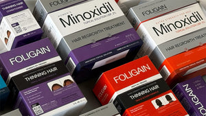 各式盒裝FOLIGAIN米諾地爾與TRIOXIDIL護髮產品。
